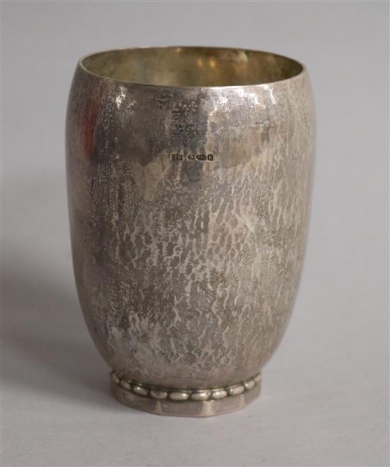 A 1920s Georg Jensen Danish planished sterling silver beaker, date for 1924, 4 oz.